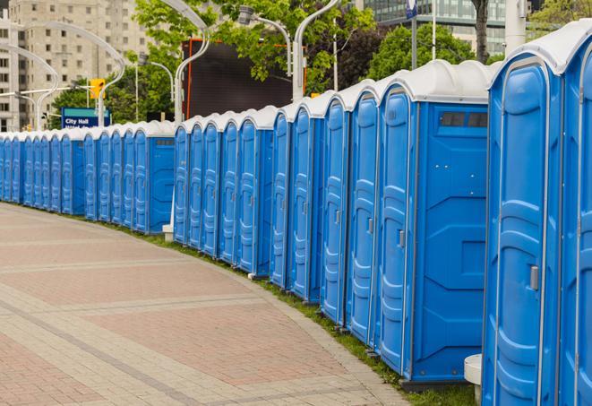 a line of brightly-colored portable restrooms, perfect for outdoor festivals and concerts in Boca Raton, FL